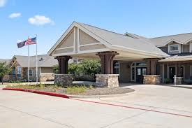 Modern building with American flags outside.