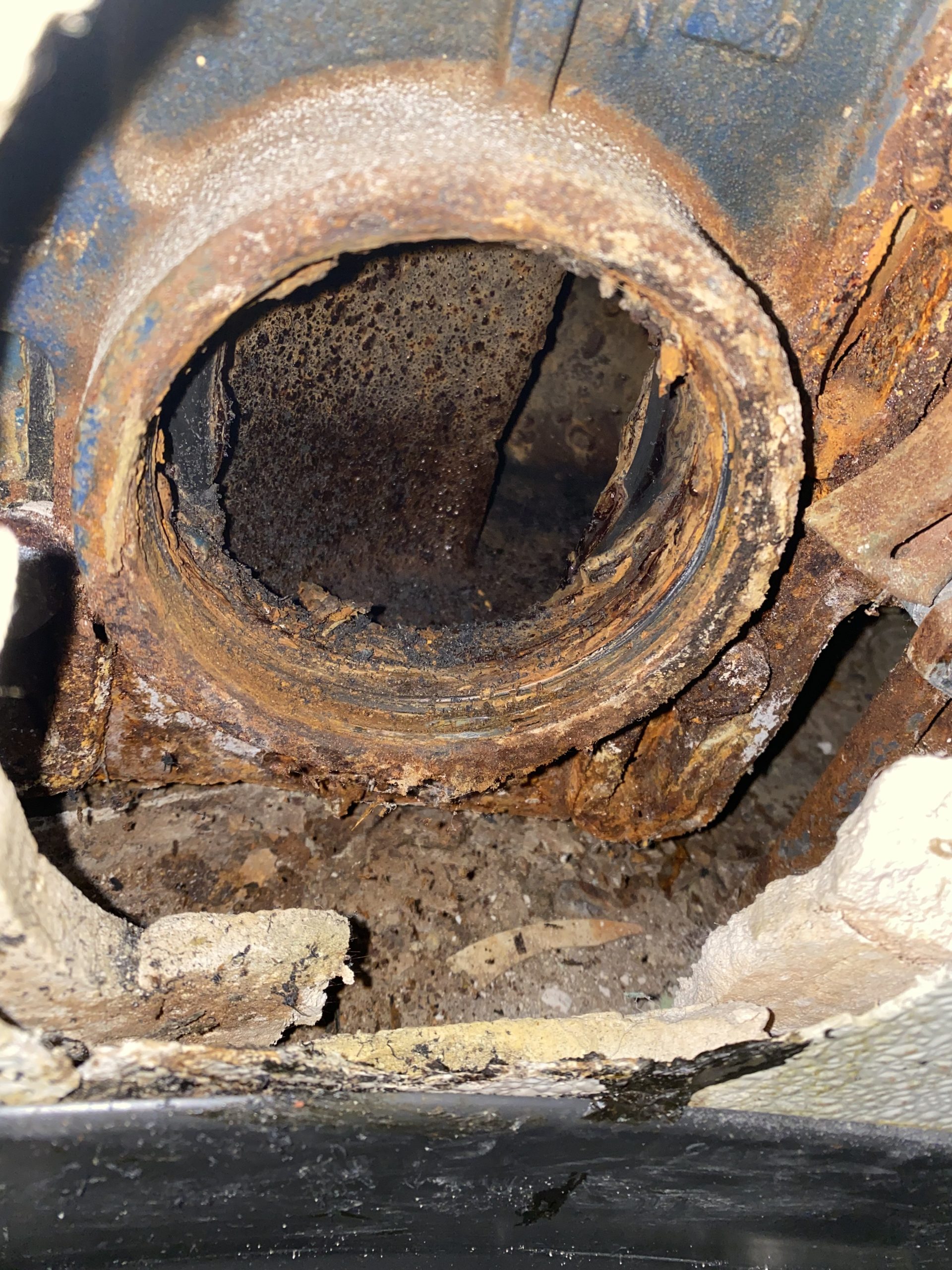 Close-up of rusty pipe with corrosion damage.